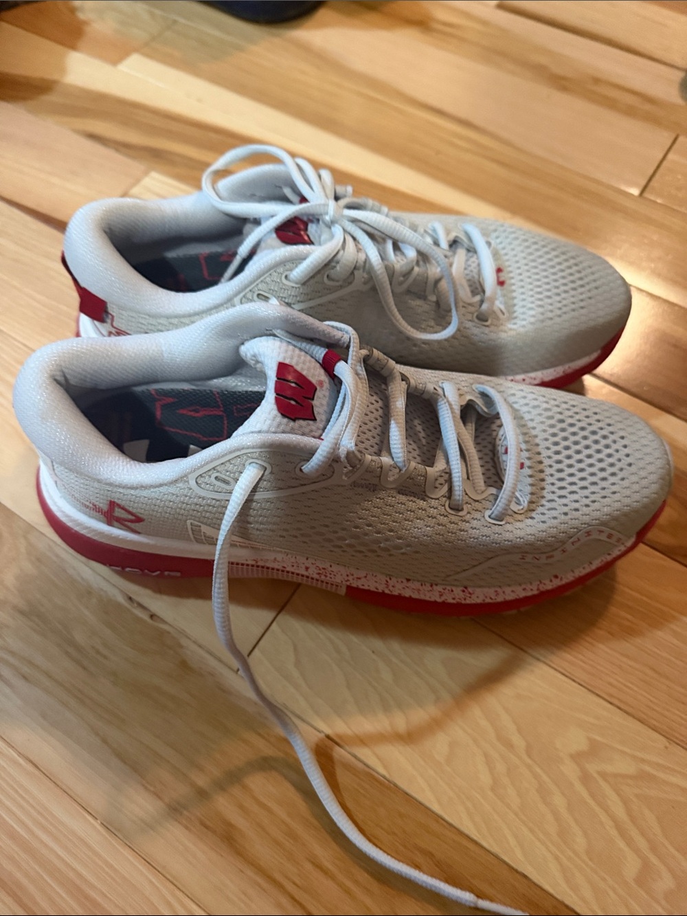 Wisconsin White and Red Performance Hovr Under Armour Shoes.